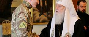 Патриарх Филарет наградил воевавших в Донбассе добровольцев из России