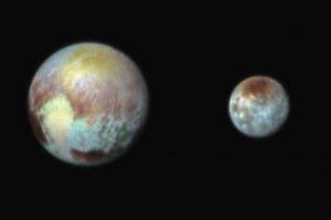 Космологи NASA опубликовали новое цветное фото Плутона и Харона