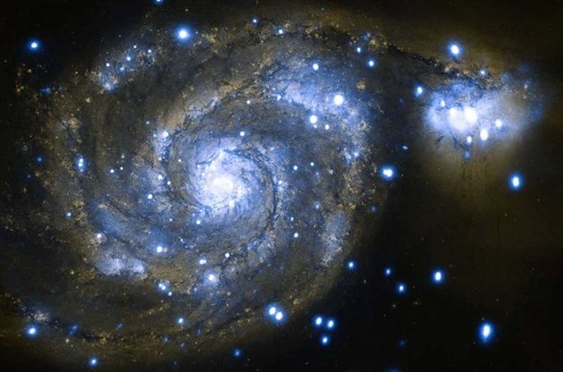 Столкновение галактик приводит к "поеданию" черной дырой целых звездных систем