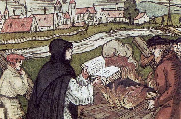 Мартин Лютер сжигает папскую буллу.
Гравюра на дереве, 1557 г