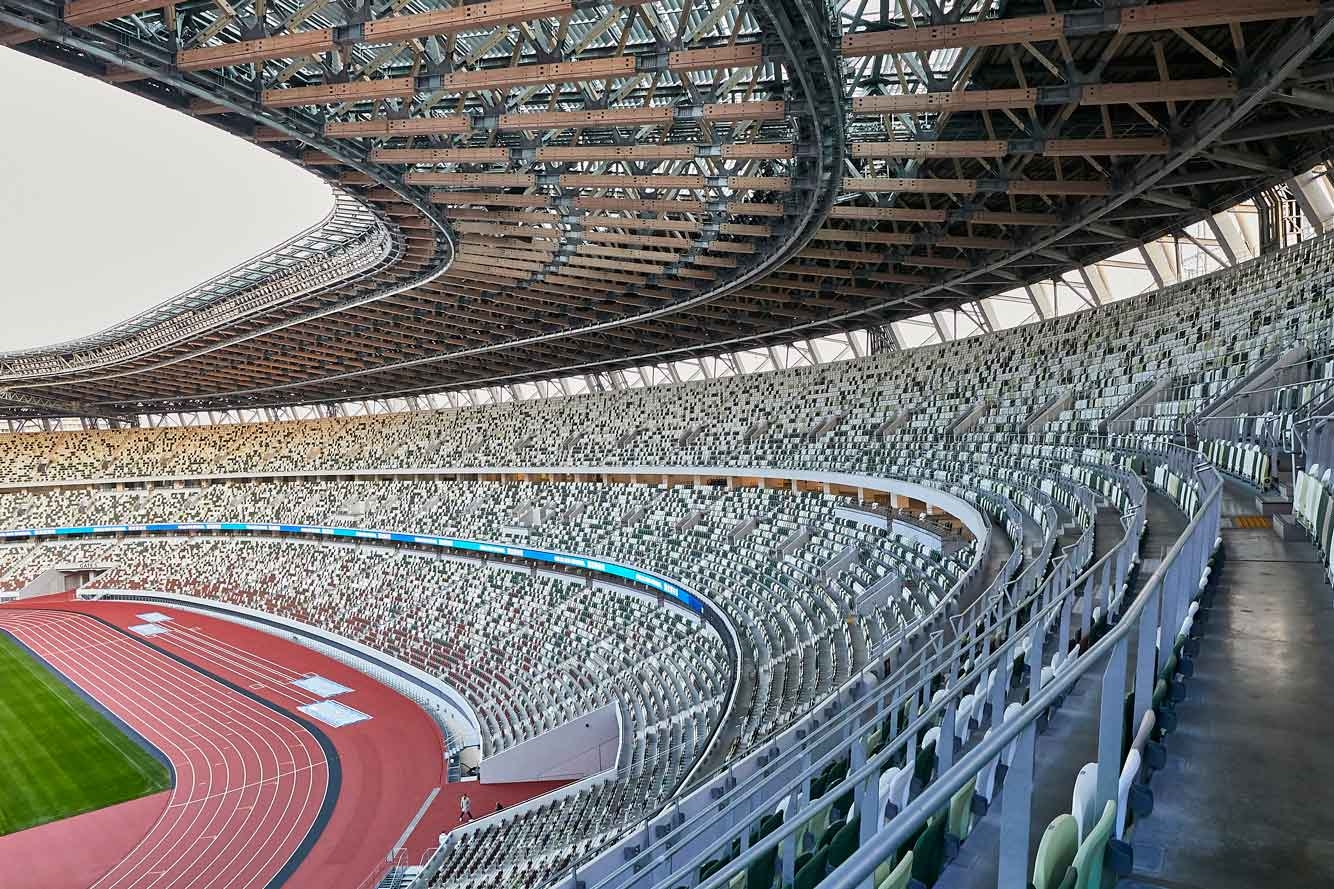 Где играет какой стадионе. Национальный стадион Токио 2020. Олимпийский стадион Токио 2020. Олимпийский стадион в Токио 2020 Япония Заха Хадид. Стадион в Японии к Олимпиаде 2020.