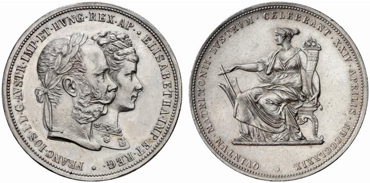 Монета достоинством в два серебряных флорина 1879 г., посвященная серебряной свадьбе монархов Монета достоинством в два серебряных флорина 1879 г., посвященная серебряной свадьбе монархов