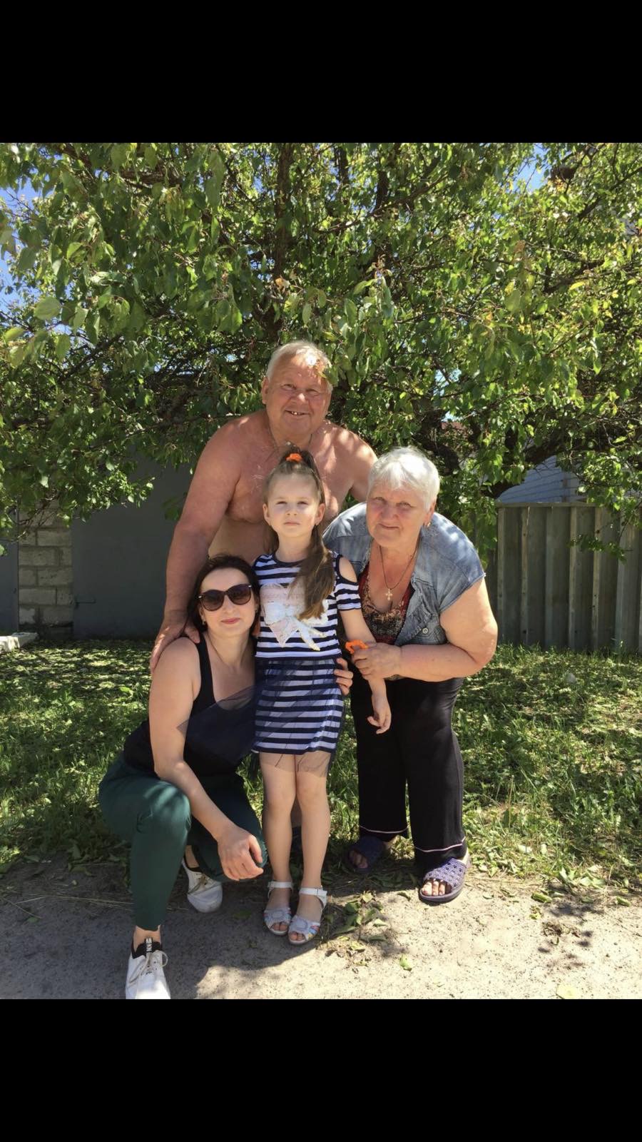 Alina with grandmother Svitlana and grandfather Oleksii