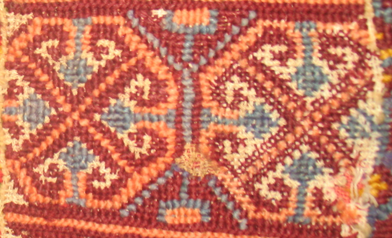 Фрагмент вышитого коврика, подаренного Мелитоном Бучинским Олене Пчилке. Музей выдающихся деятелей украинской культуры