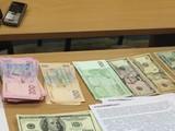 Сотрудники ГФС в Харькове попались на взятке в 100 тысяч грн и 10 тысяч долларов