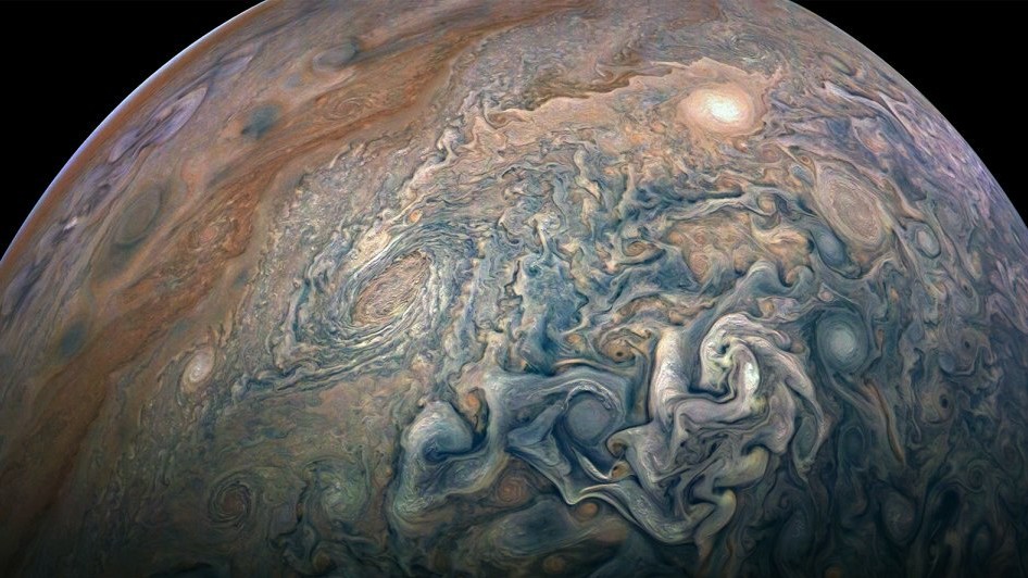 Супутники Юпітера відкидають тінь на сяйва на планеті